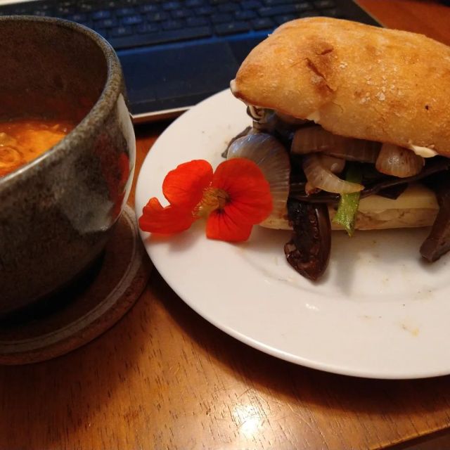 Making sure I snagged a nasturtium flower before the freezer last weekend, I had a sandwich that was grilled eggplant slices, cheddar cheese, and grilled onions and peppers. On ciabatta with mayonnaise. And a side of one flower and a bowl of cheesy dip with chips