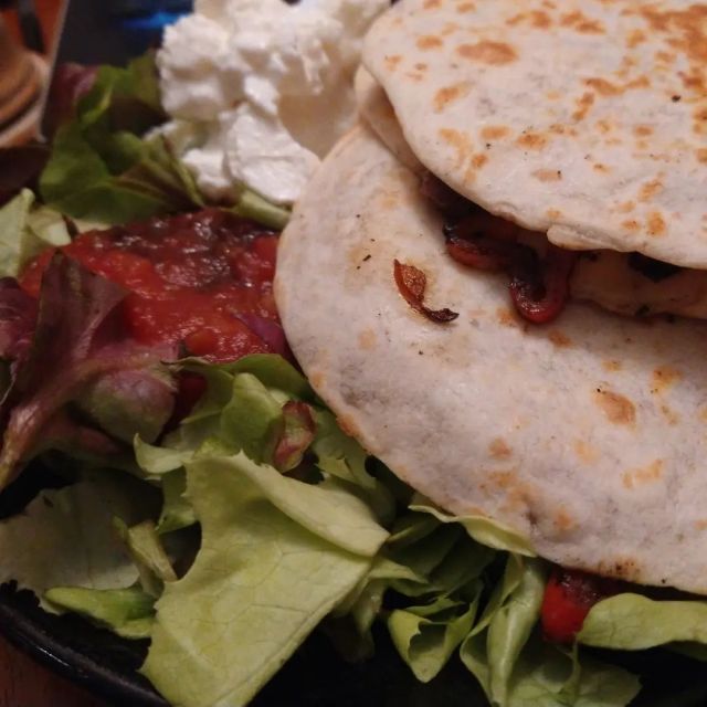 A few different meals

Picture 1) quesadillas (made with those mail order handmade flour tortillas, cheddar cheese, onions, peppers, and mushrooms) on a platter with lettuce, salsa, and  strained yogurt. None of that is garnish - I ate it all

Picture 2) potatoes #frommygarden that were microwaved and then mashed with butter. Topped with cooked onions, red long pepper from @italianmarketphilly , an orange pepper #frommygarden, and some garlic from @gilgalad5 . And cheddar cheese and strained yogurt

Picture 3) pasta! With butter, onion, garlic, and a splash of red wine. Some purple cabbage. About 1/4 of a can of diced tomatoes. And cheese!